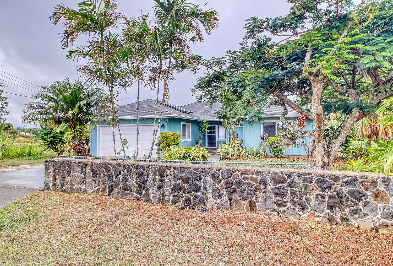 Cute Hawaiian style home with rock walls, distant ocean views, and large agricultural land behind.  Home features new paint inside and out and new foors.  Perfect for the Buyer looking for a home on Kaua;'is famous East Shore.