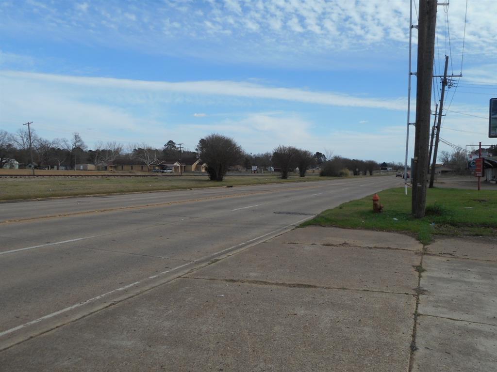 a view of a road with an ocean view