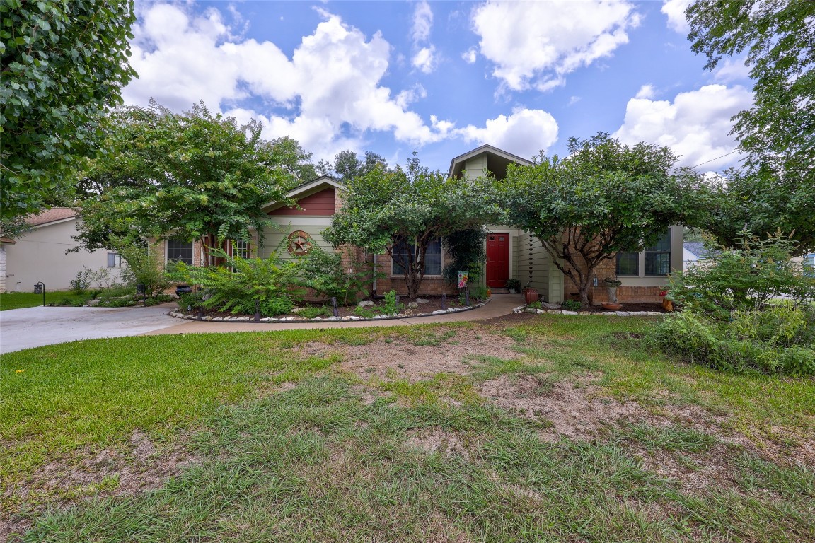 Front of home, shaded with landscape