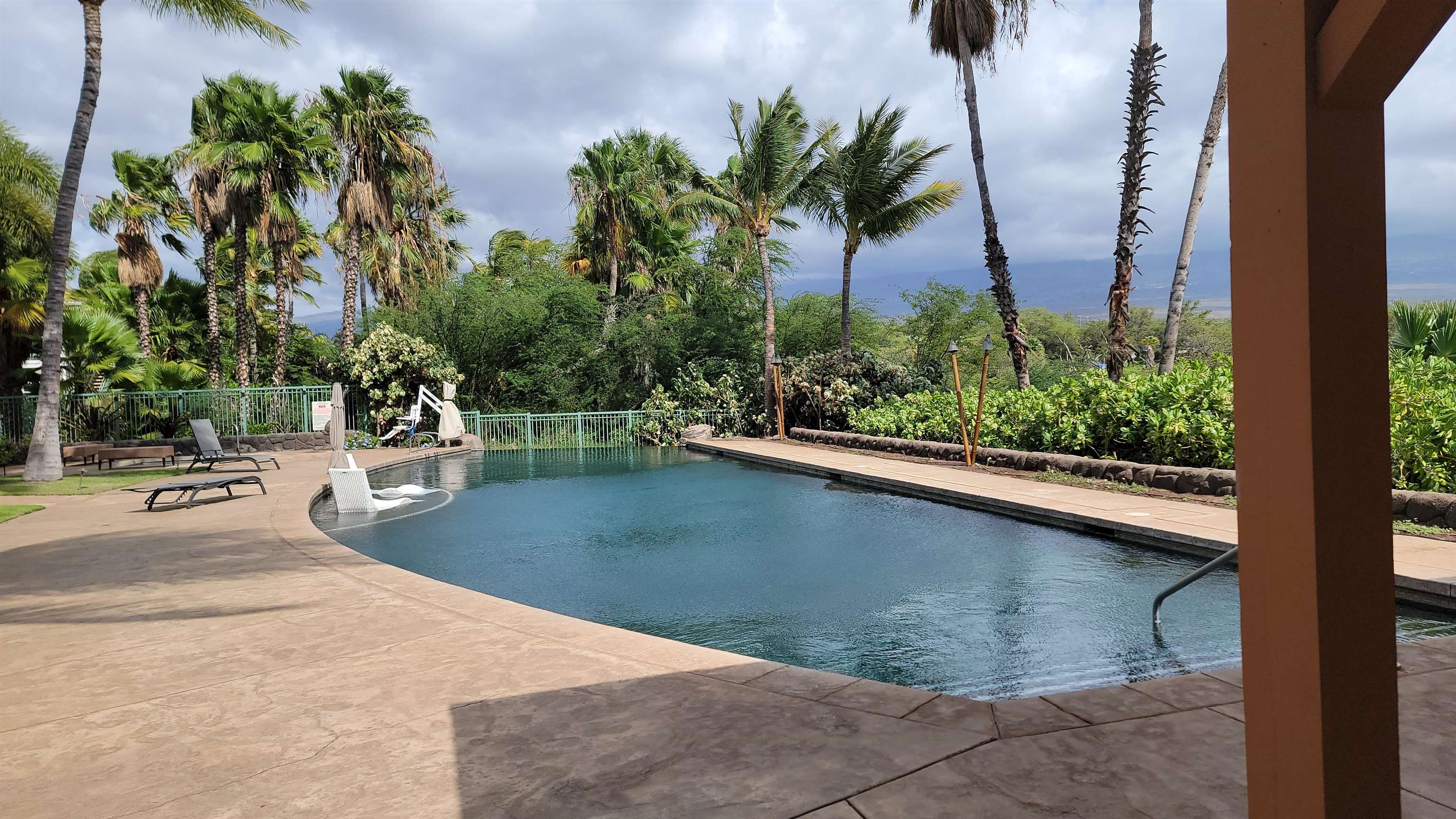 a view of a swimming pool with a patio