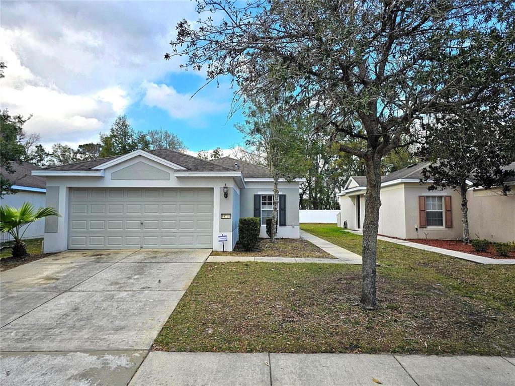 front view of a house with a yard