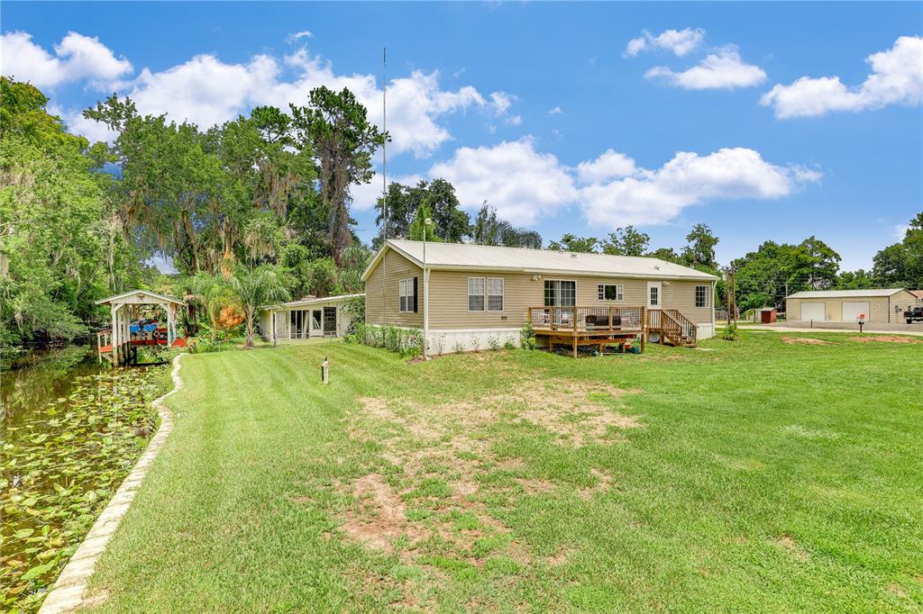 a view of a house with a big yard