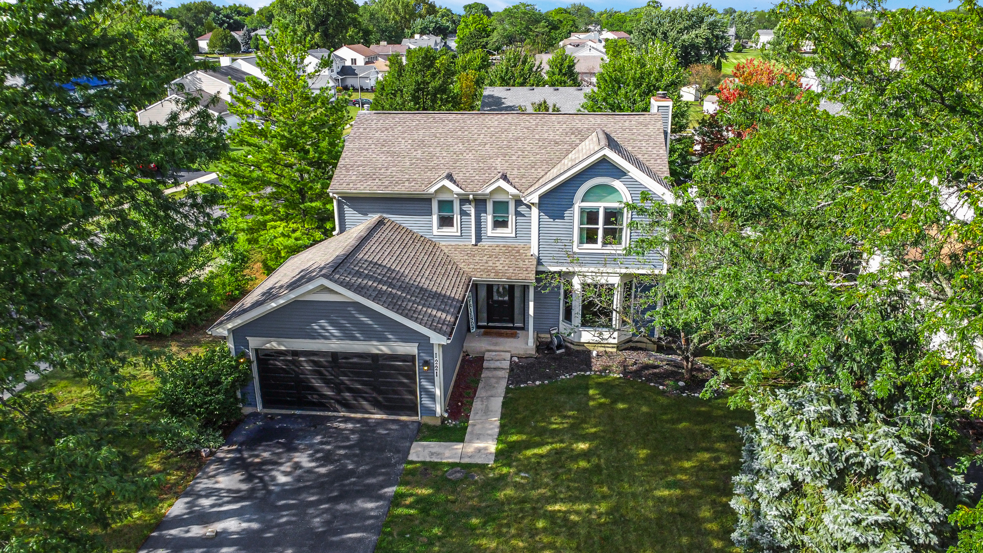 a house with trees in the background