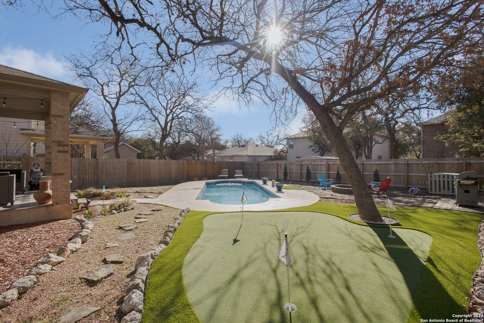 a view of a swimming pool with a patio