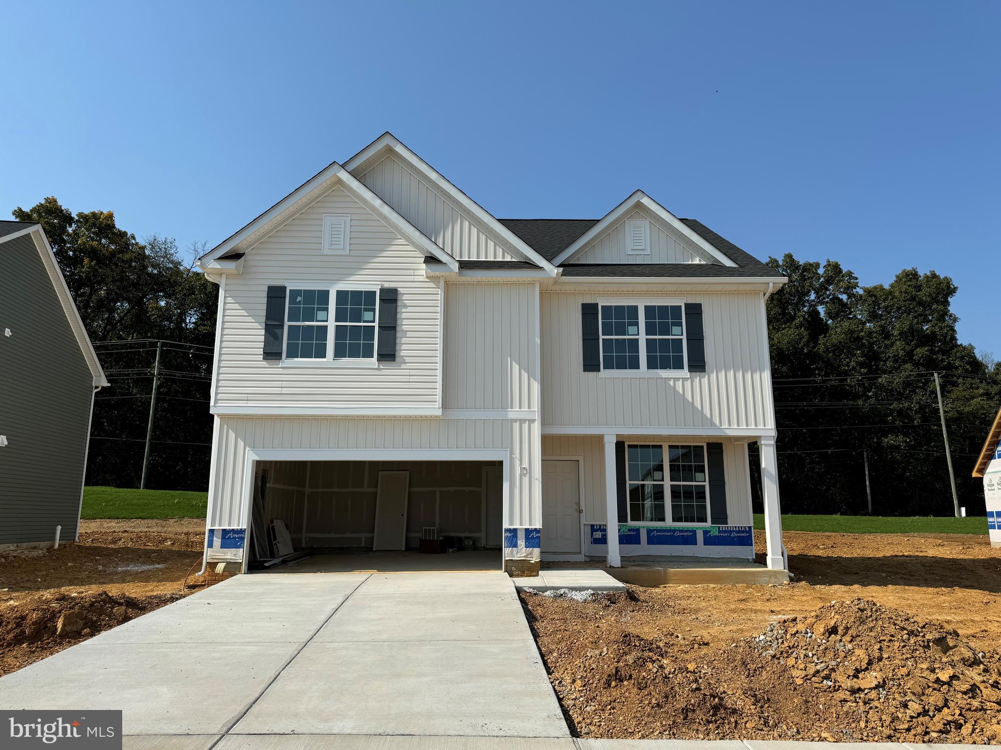 a front view of a house with yard