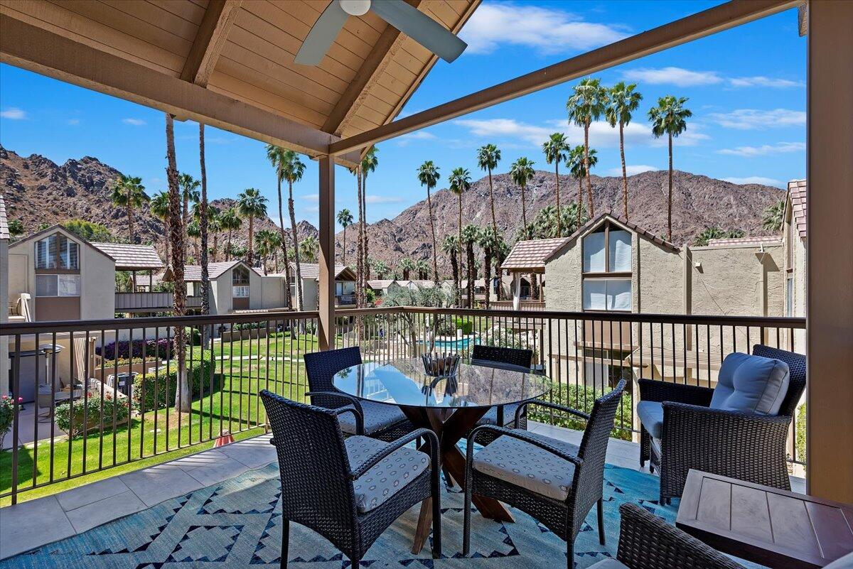 a view of a chairs and table in patio