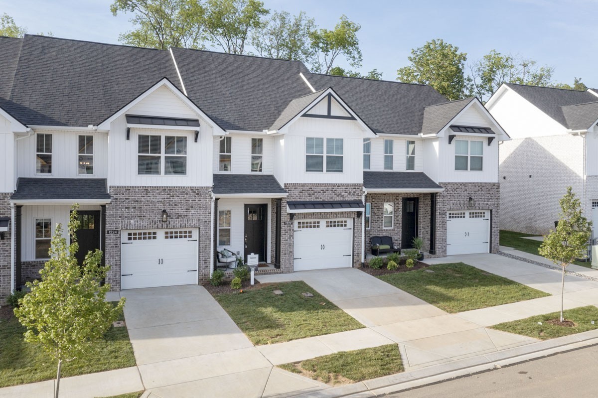 a view of house with yard and entertaining space