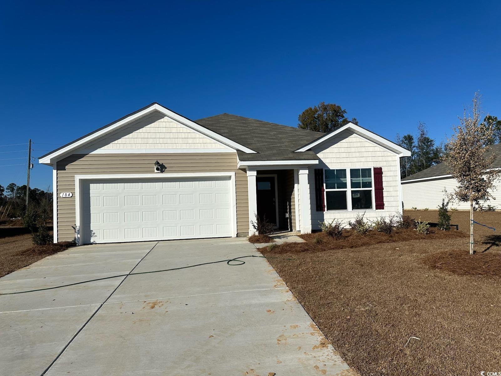 Single story home featuring a garage