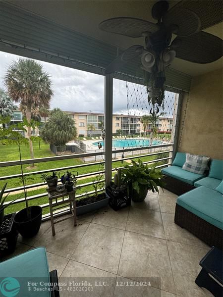 a sitting area with furniture and a yard