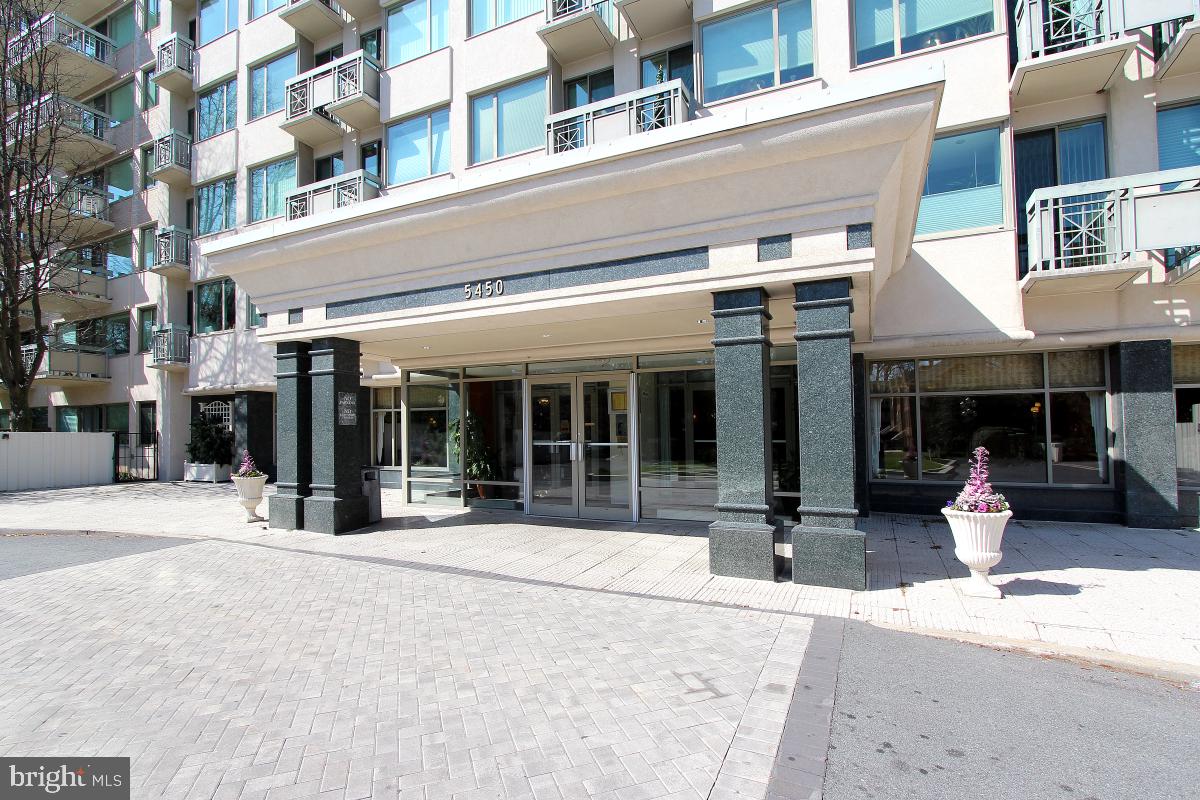 a view of a building with sitting area