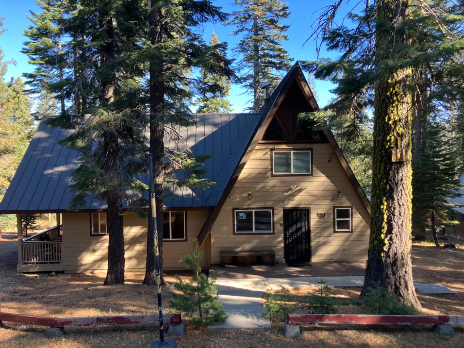 a view of house with yard