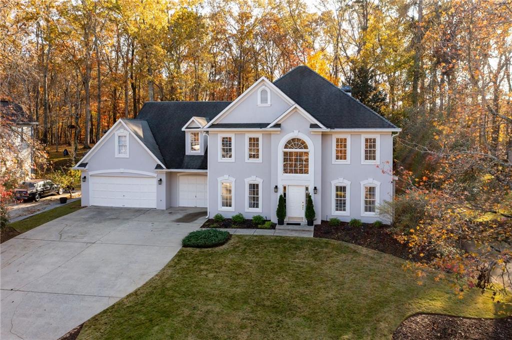 a front view of a house with a yard