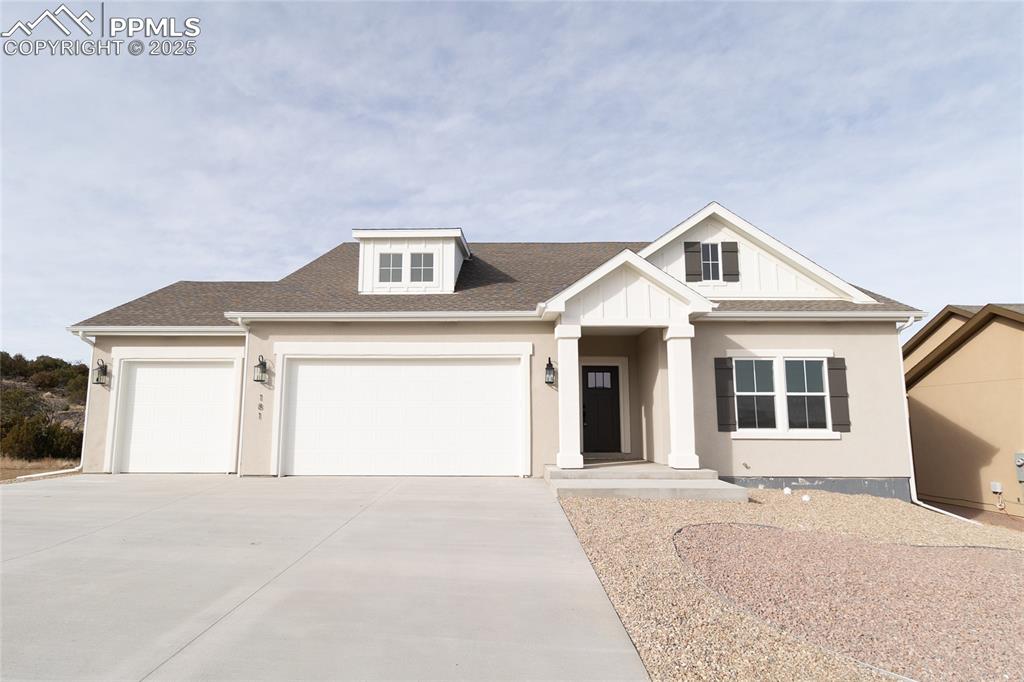 View of front of home featuring a garage