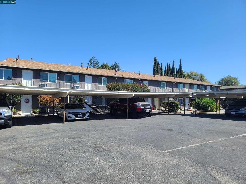 a view of a car park in front of house