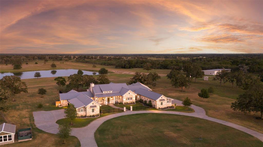 an aerial view of a house with a garden