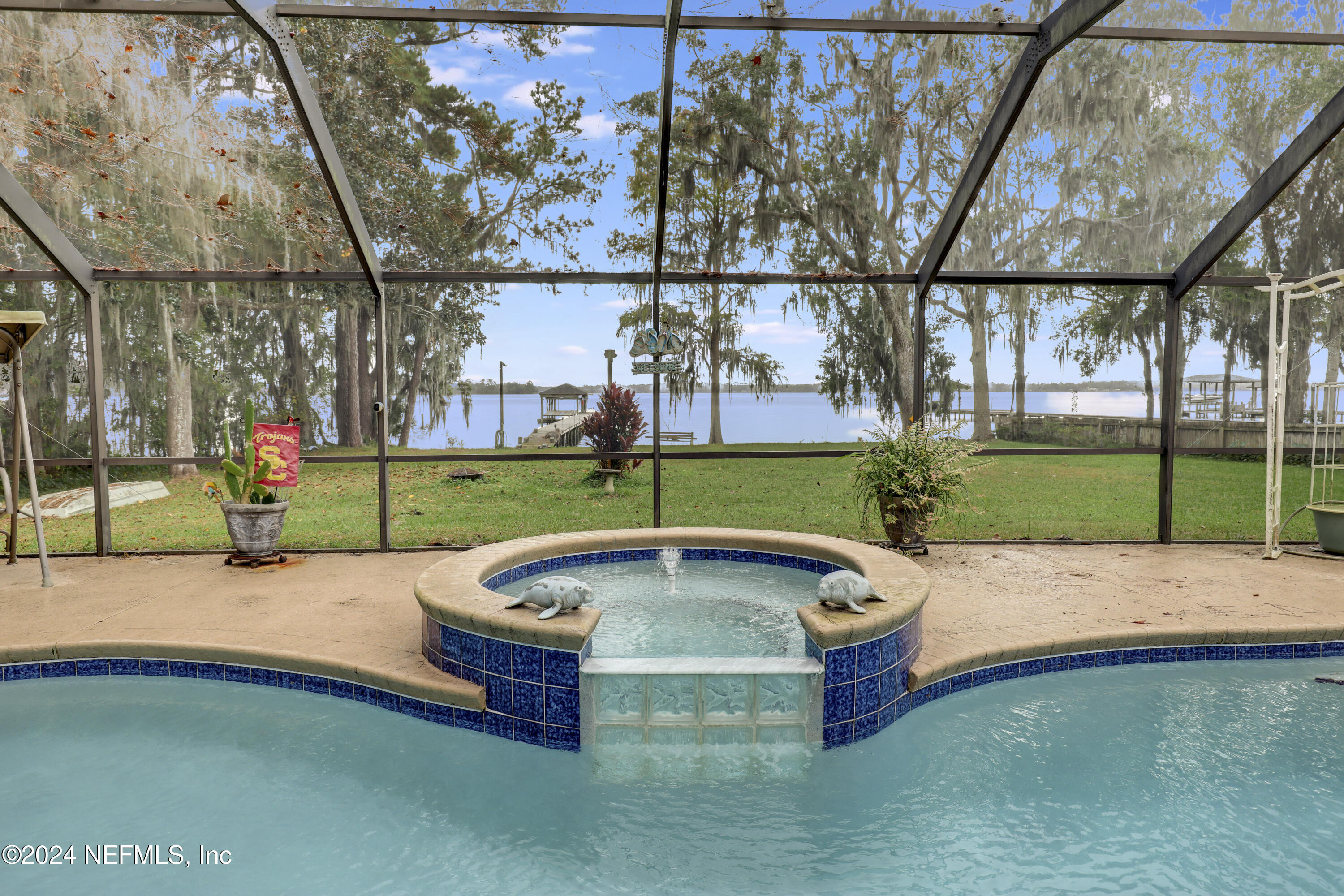 a swimming pool with outdoor seating and yard