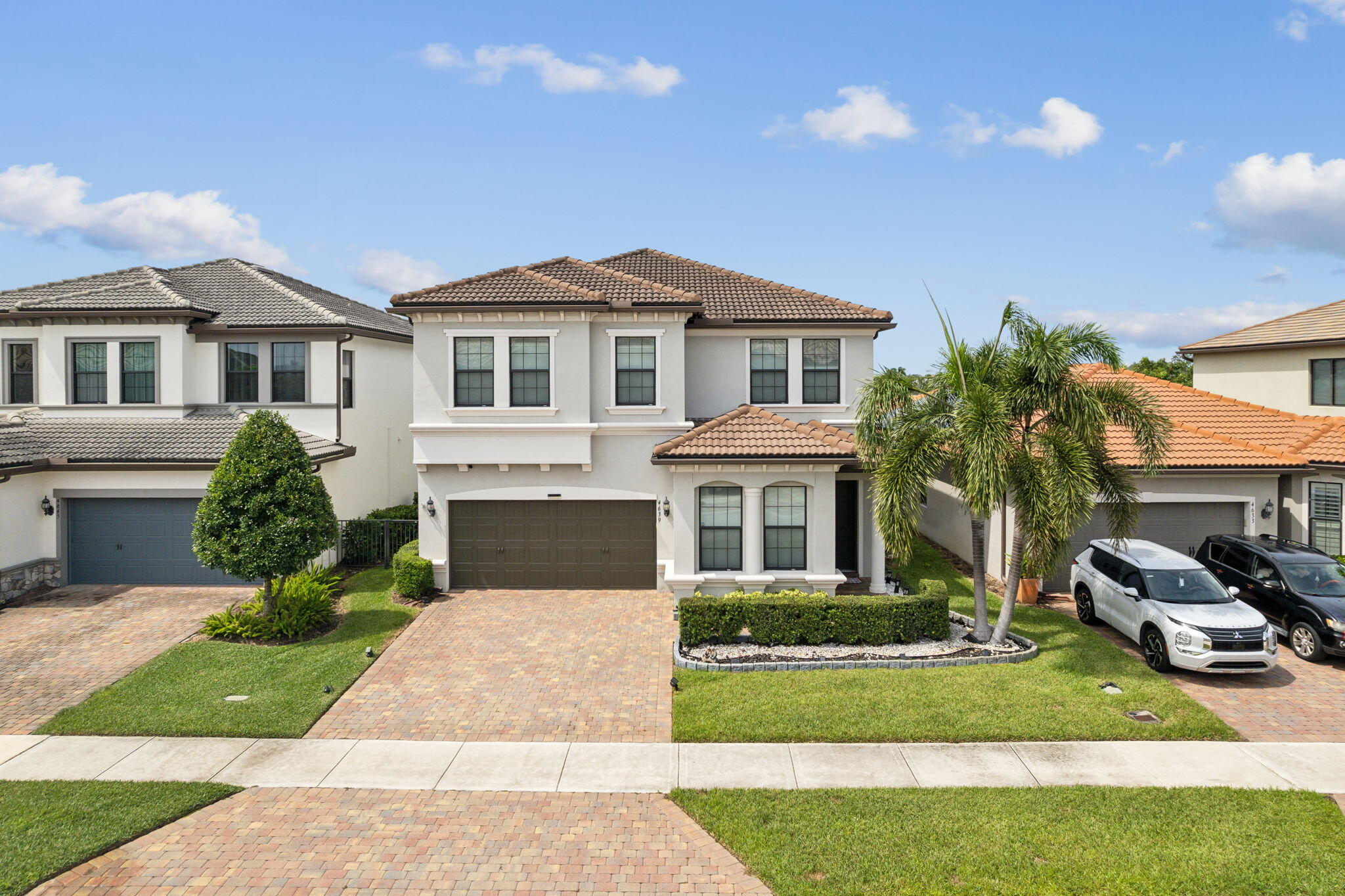 a front view of a house with a yard