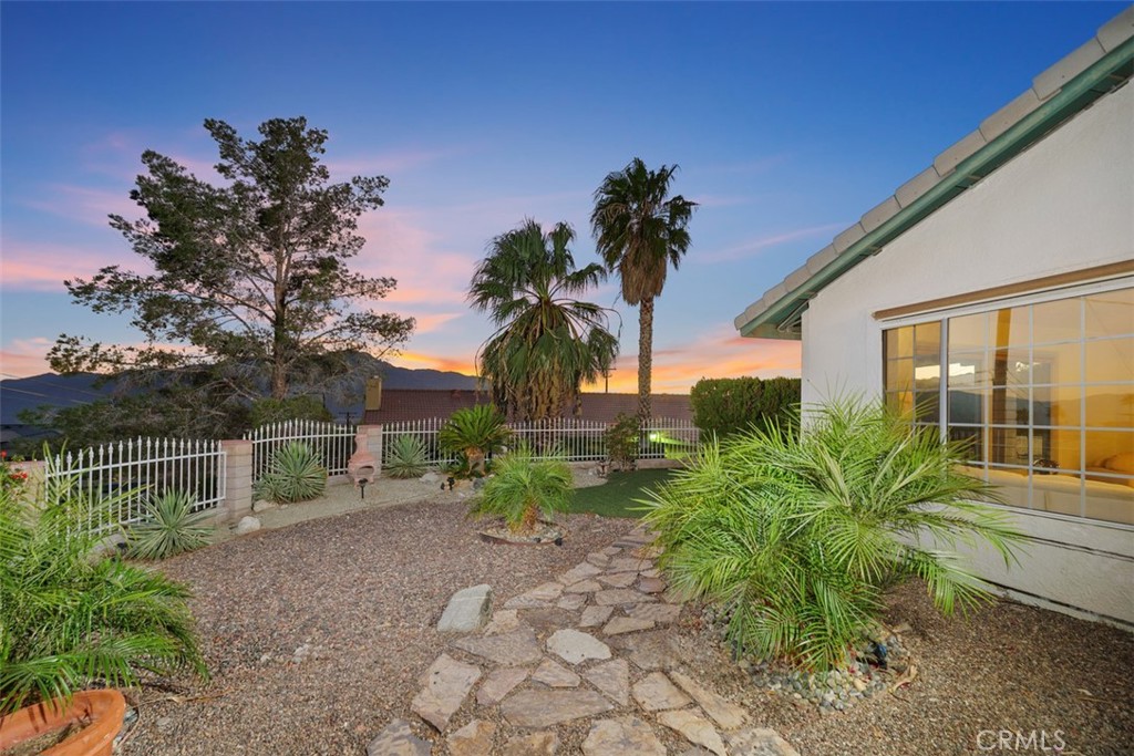 a house view with a garden space