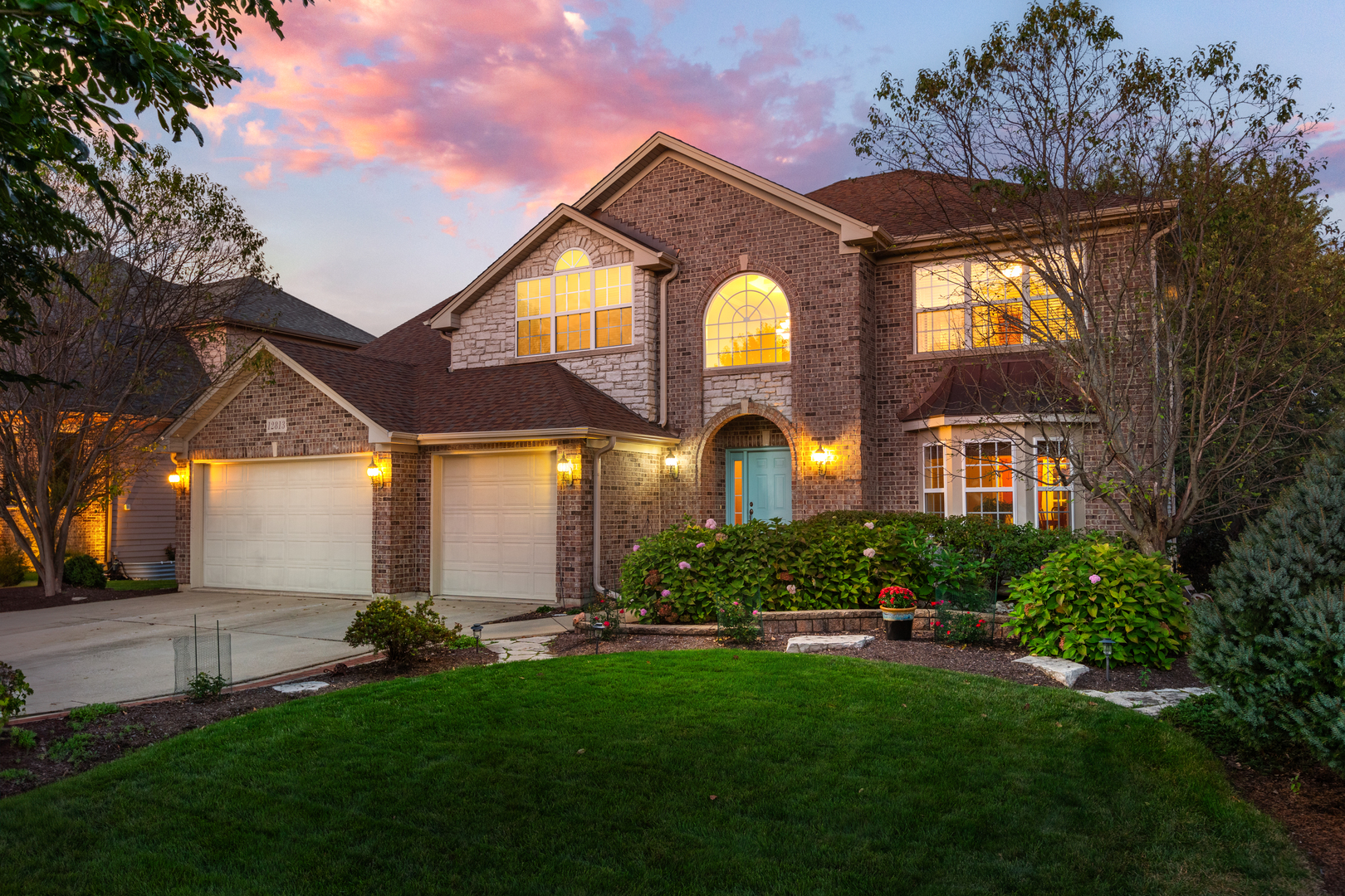 a front view of a house with a yard