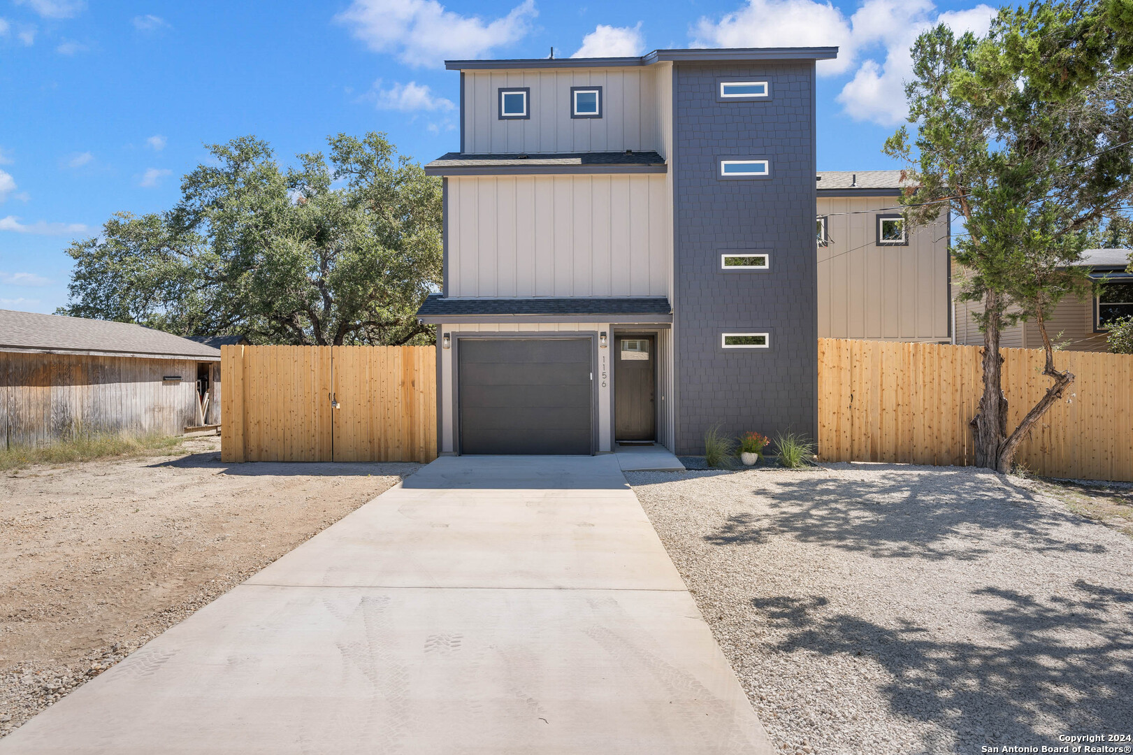 a front view of a house with a garage