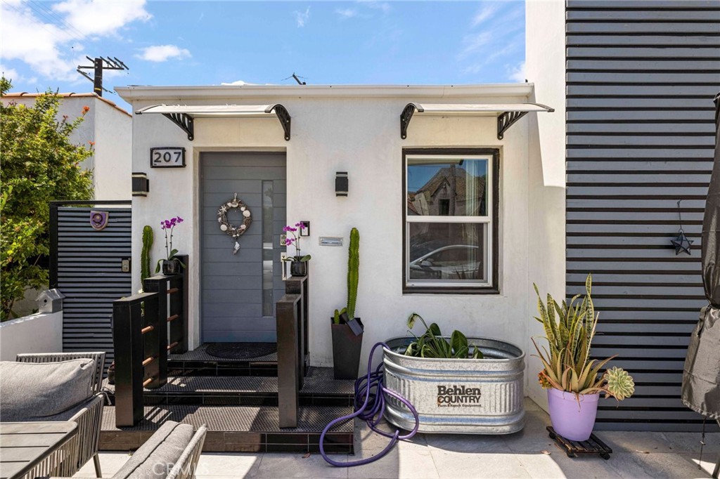 a front view of a house with patio