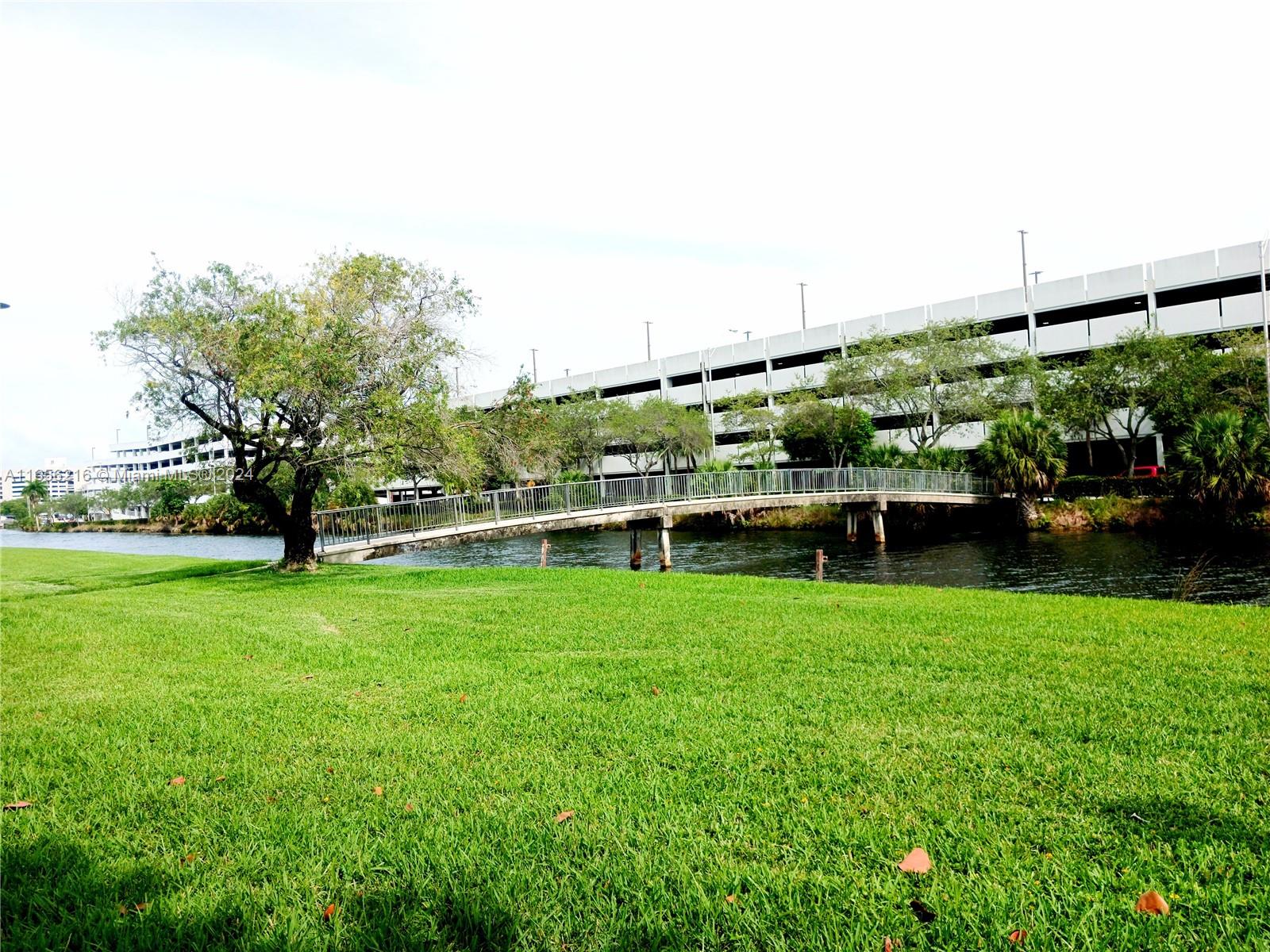 a view of backyard with seating area and green space