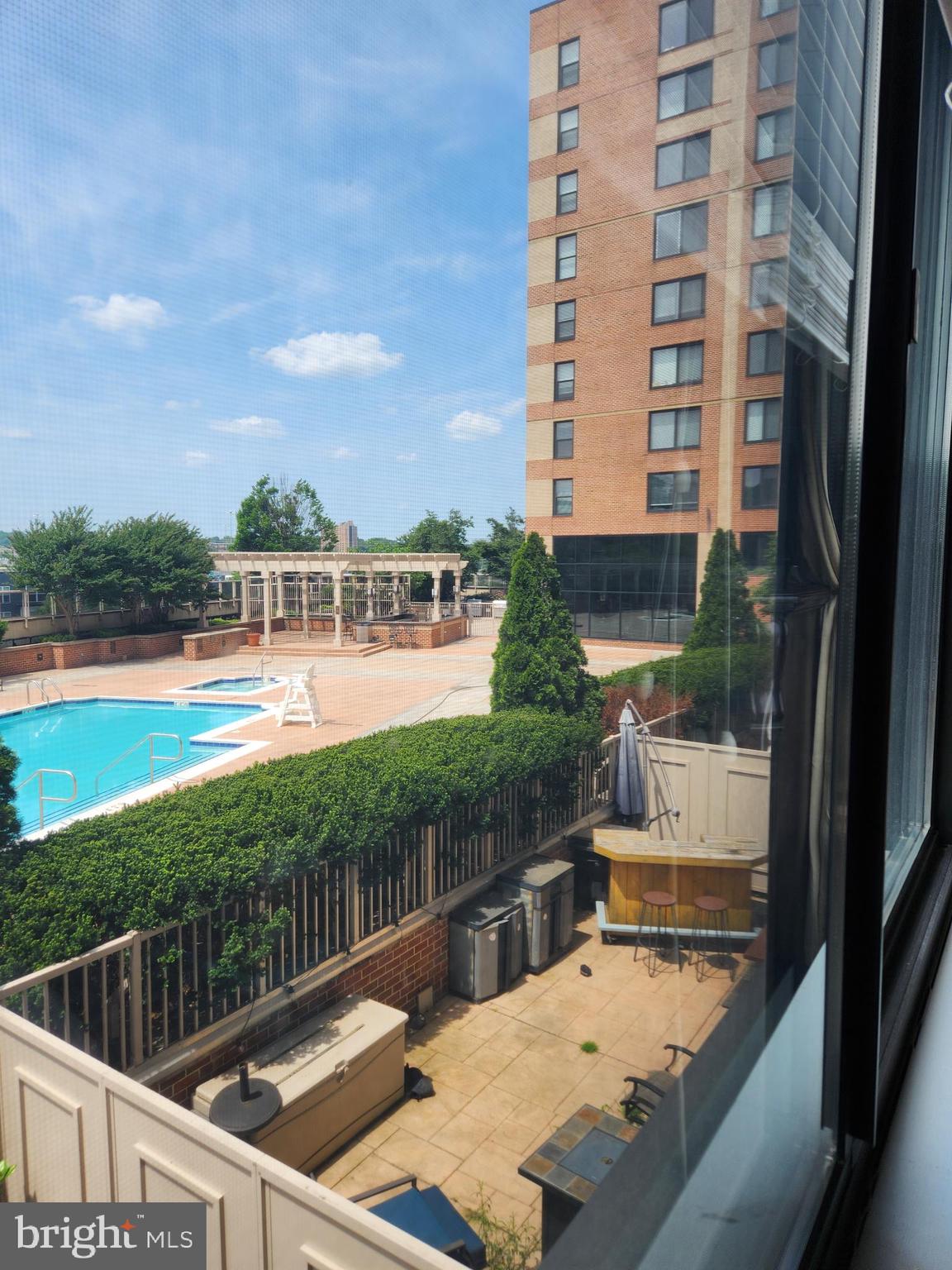 a view of swimming pool from a balcony