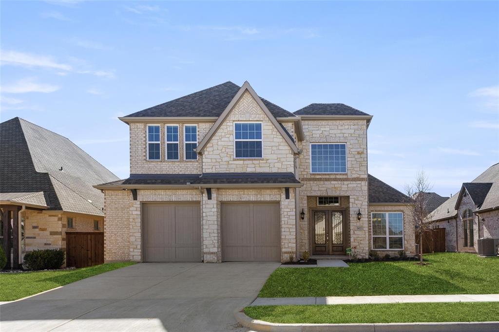 a front view of a house with a yard