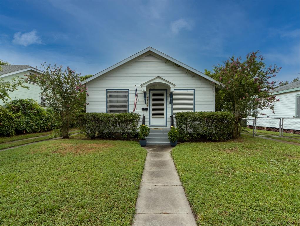 Circa 1928 one story cottage with three bedrooms, central air and heat, one car garage and fenced backyard. Driveway to garage on the left.