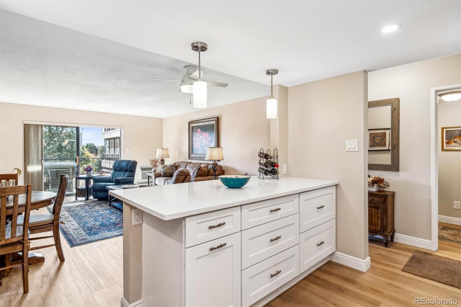 a view of living room with granite countertop furniture and wooden floor