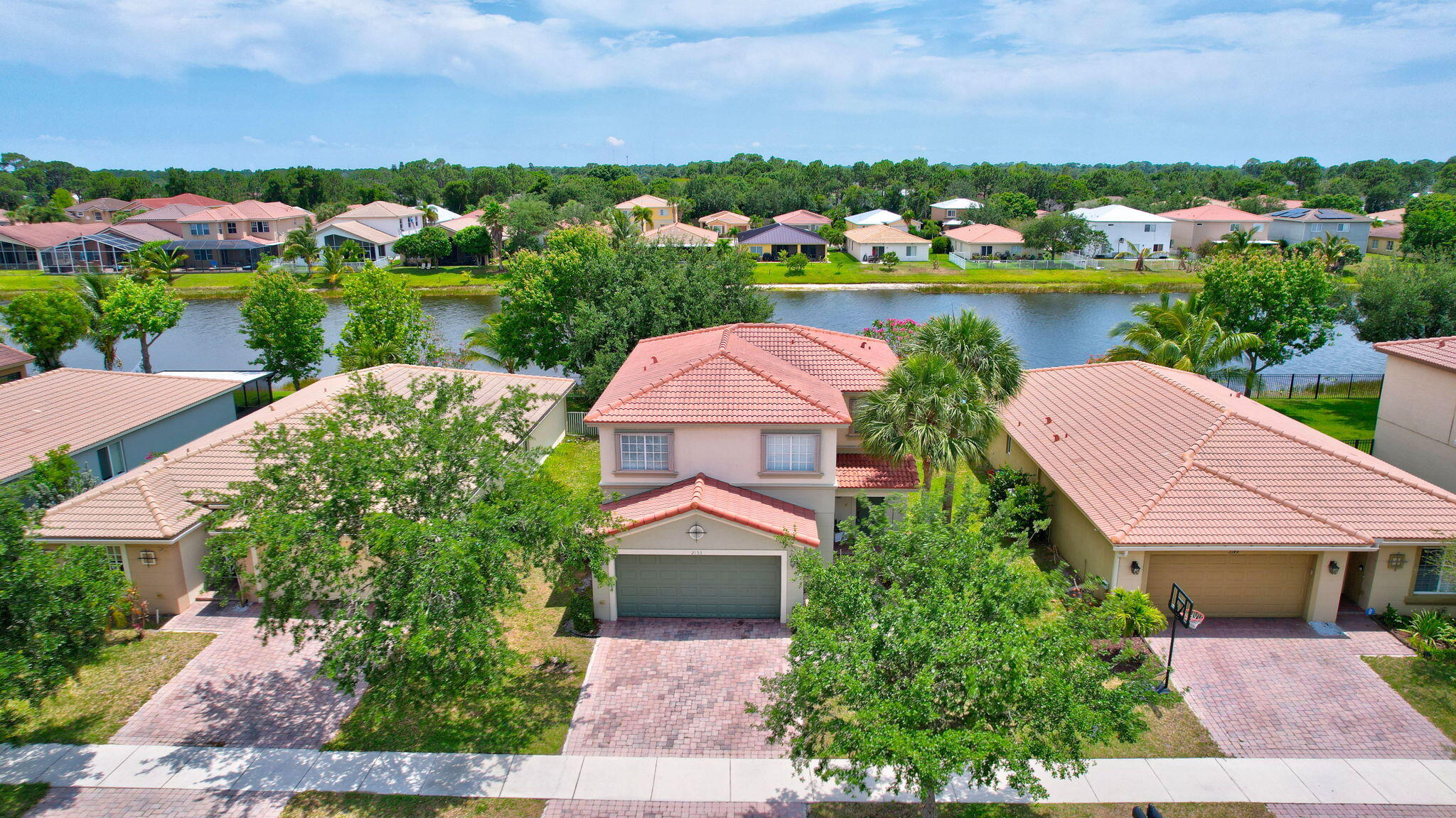 an aerial view of house with yard swimming pool and outdoor seating