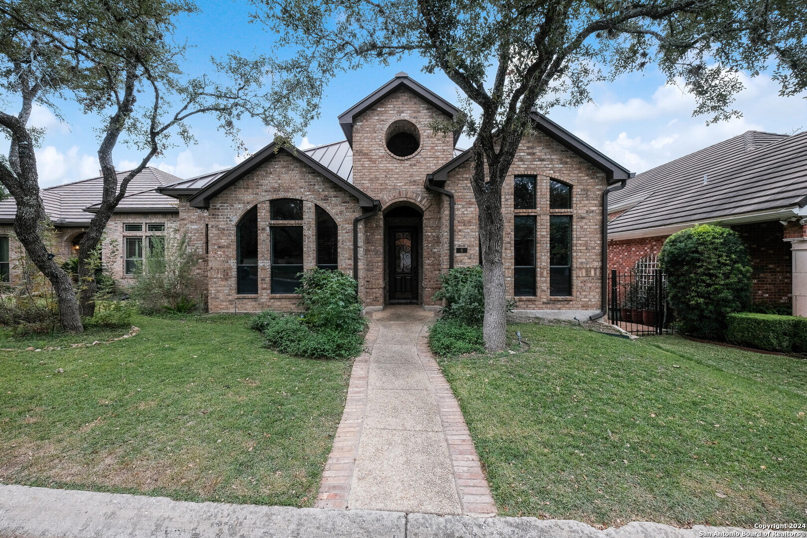 a front view of a house with garden