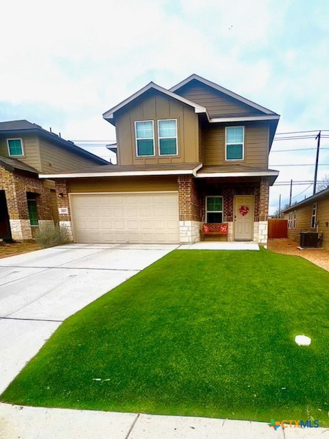 a front view of a house with a yard