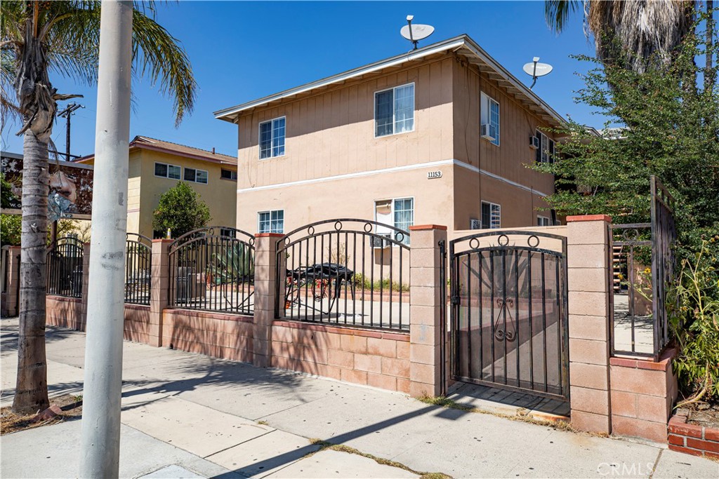 a view of a house with a fence