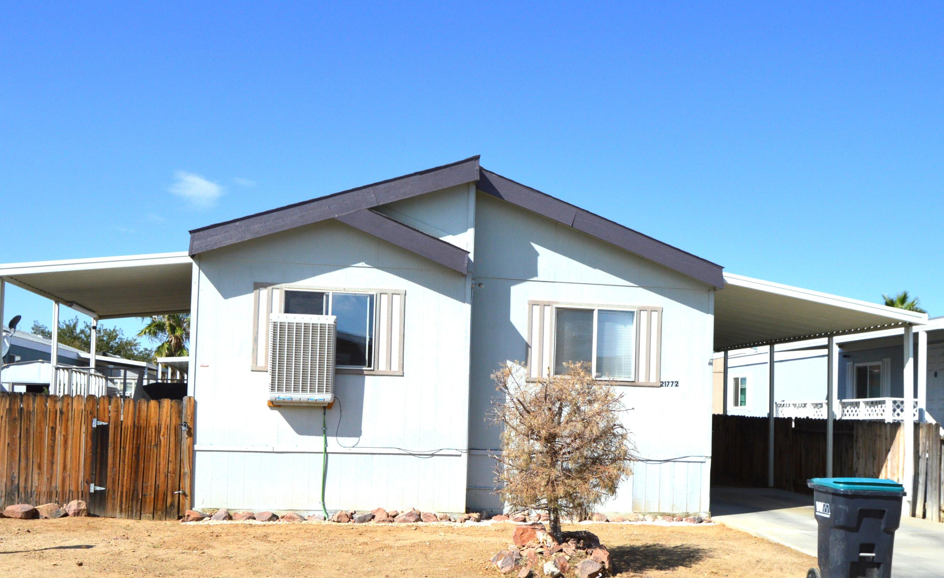 a front view of a house with a patio