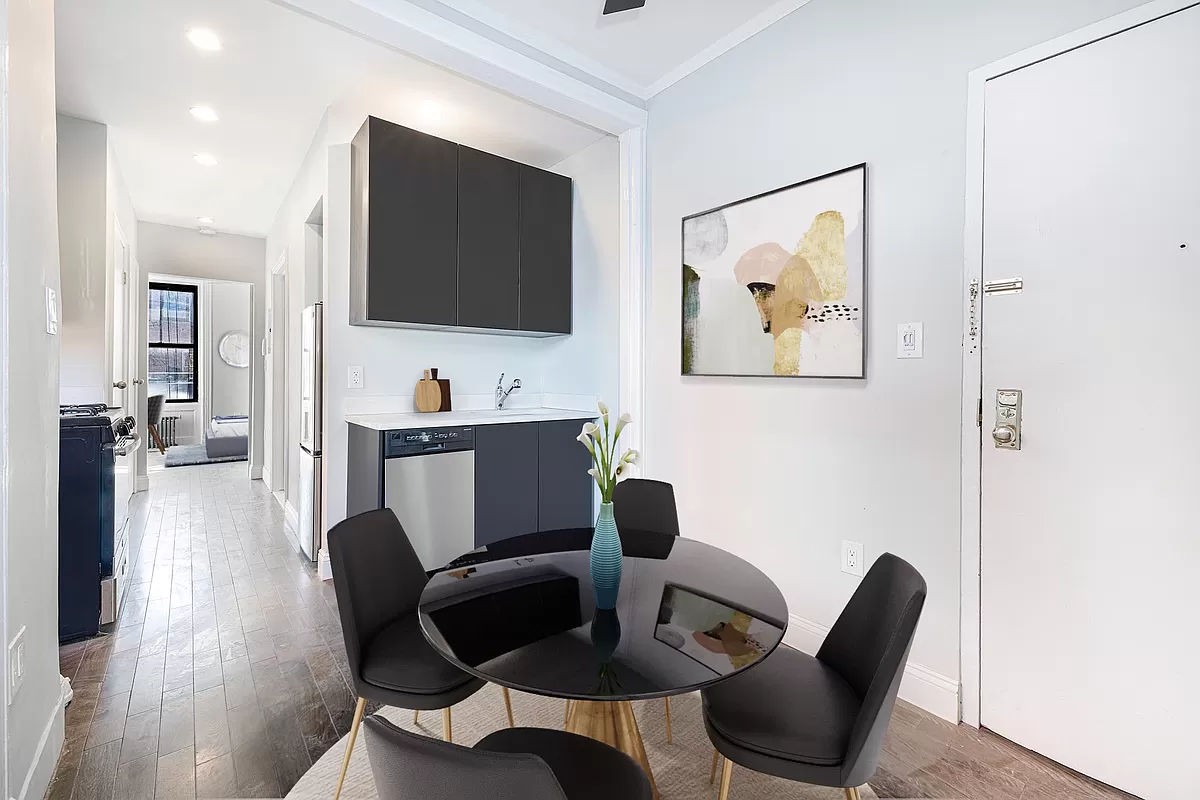 a view of a livingroom with furniture and a flat screen tv