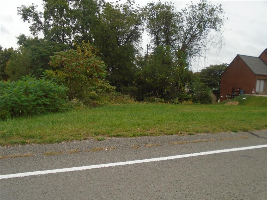 a view of a house with a yard and garage