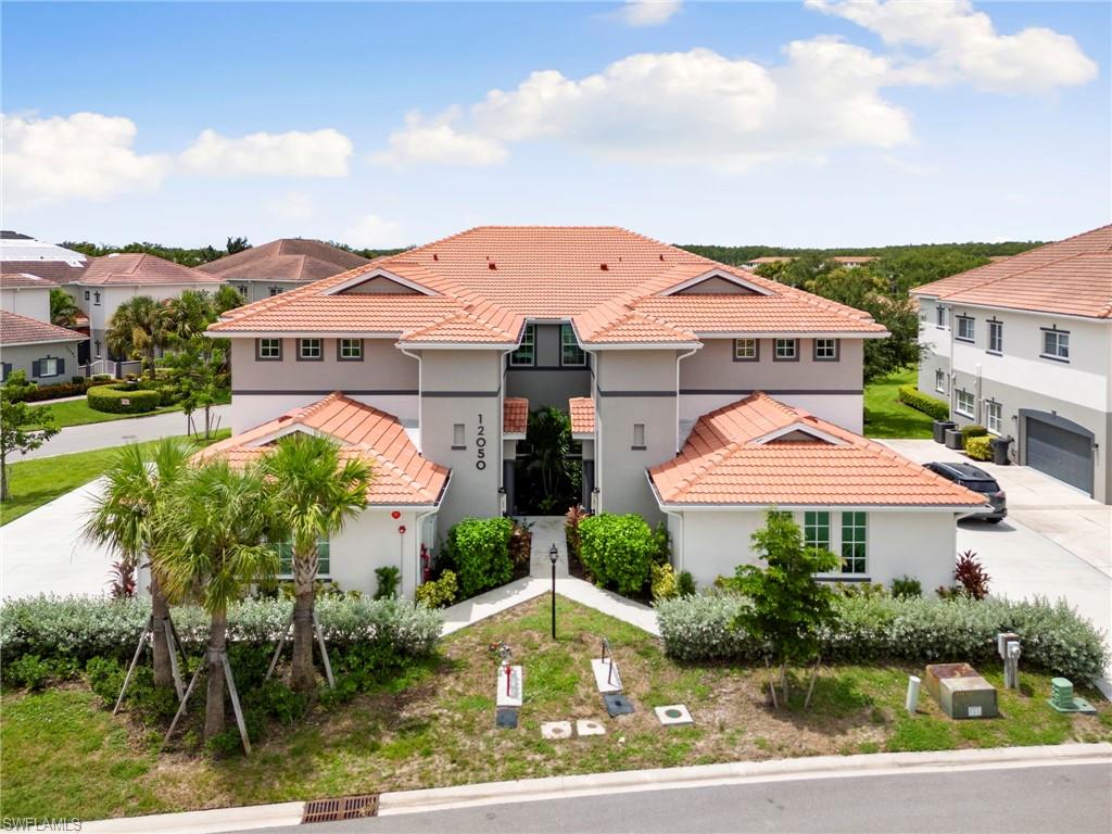 Mediterranean / spanish-style house featuring a garage