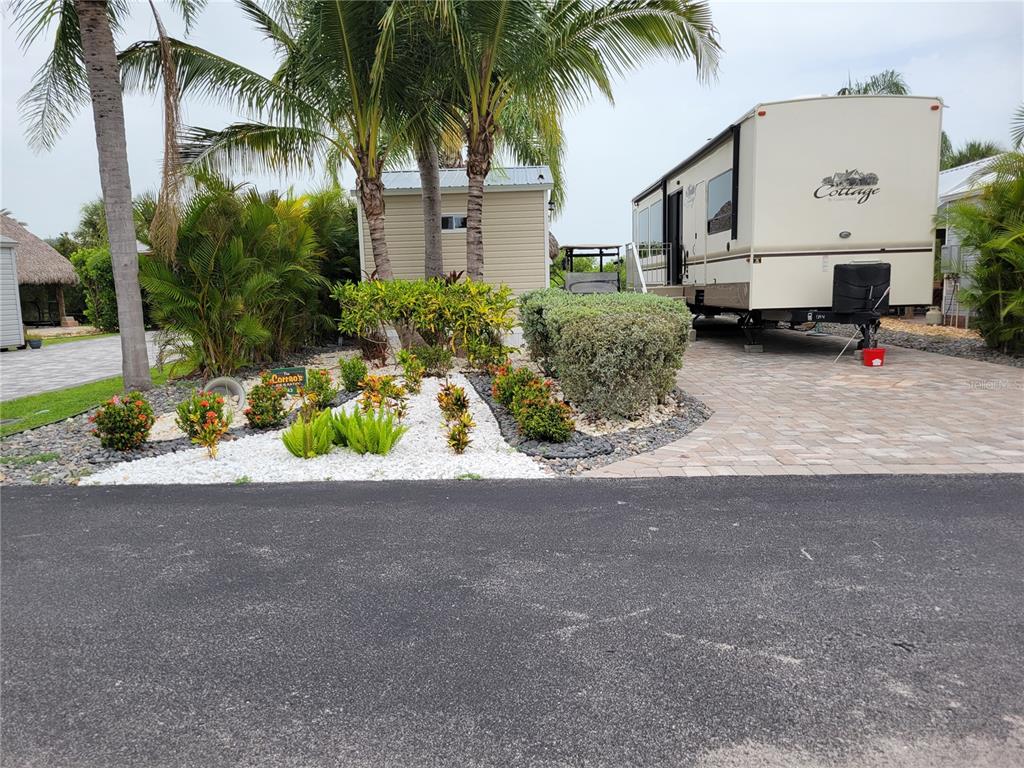 a front view of a house with a yard and a garage