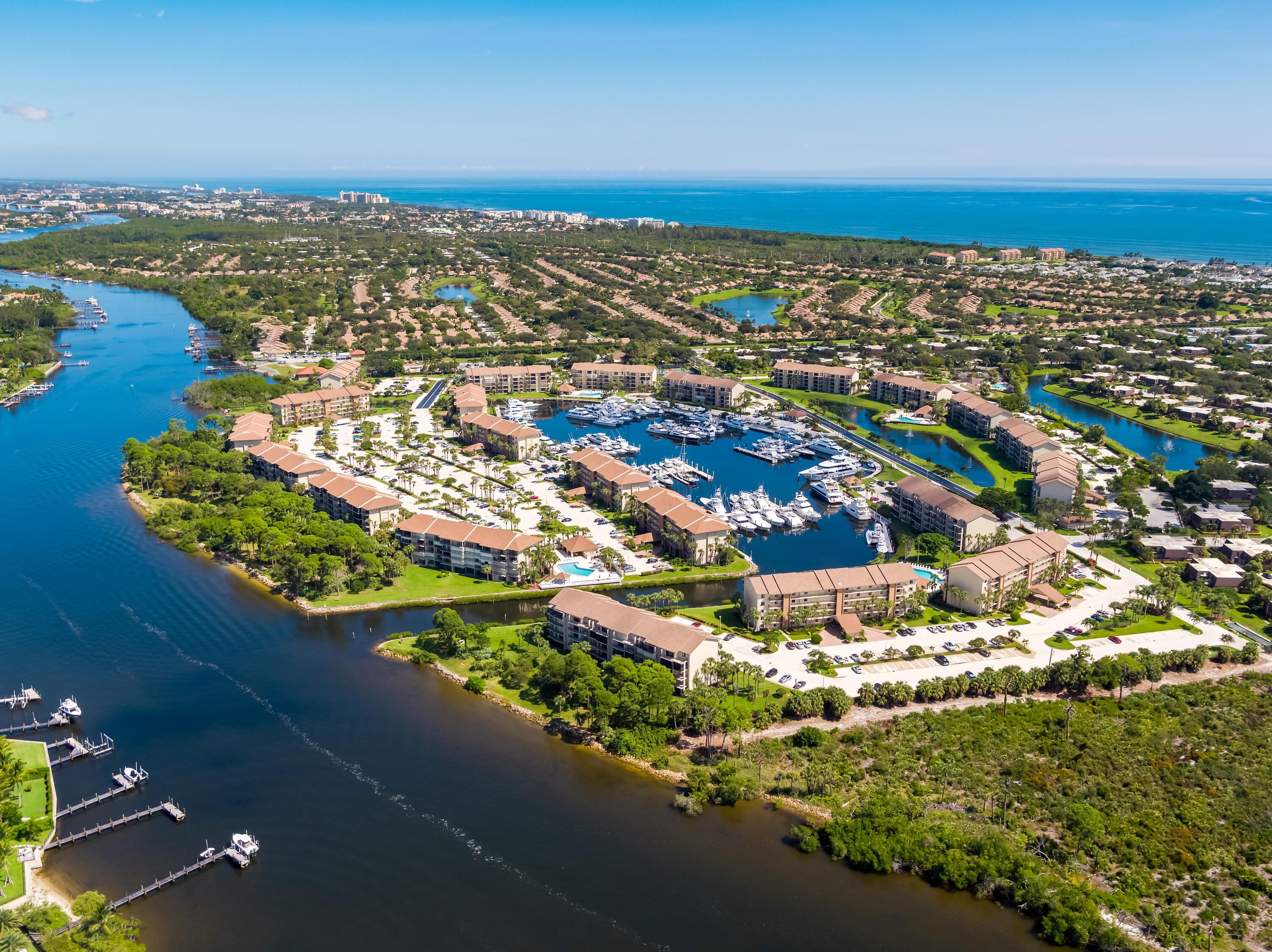 an aerial view of residential building and lake