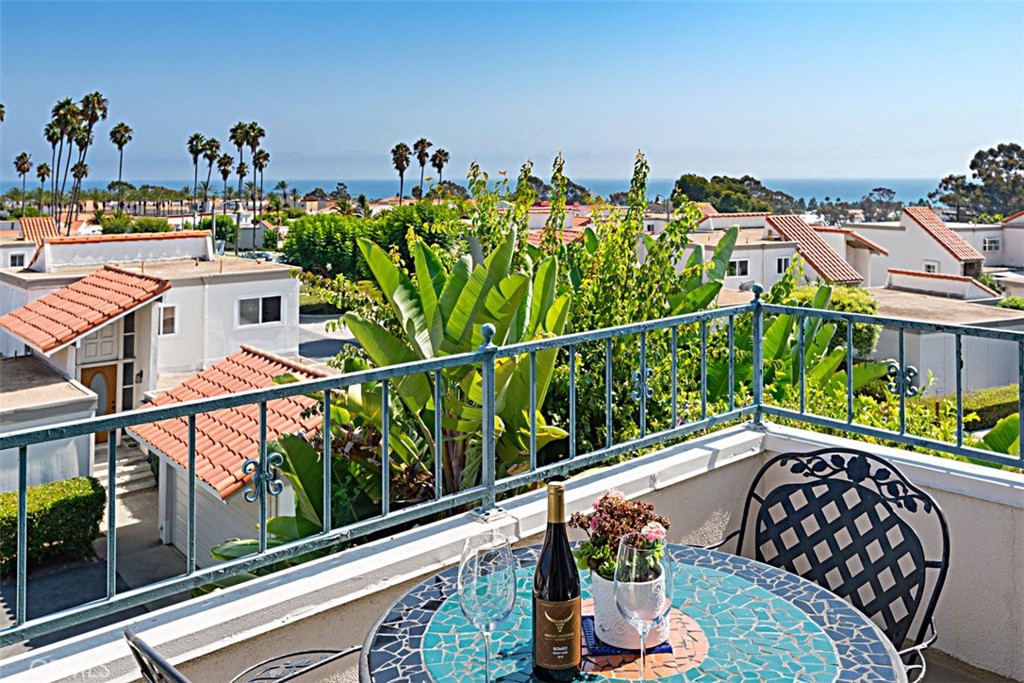 a view of a balcony with chairs