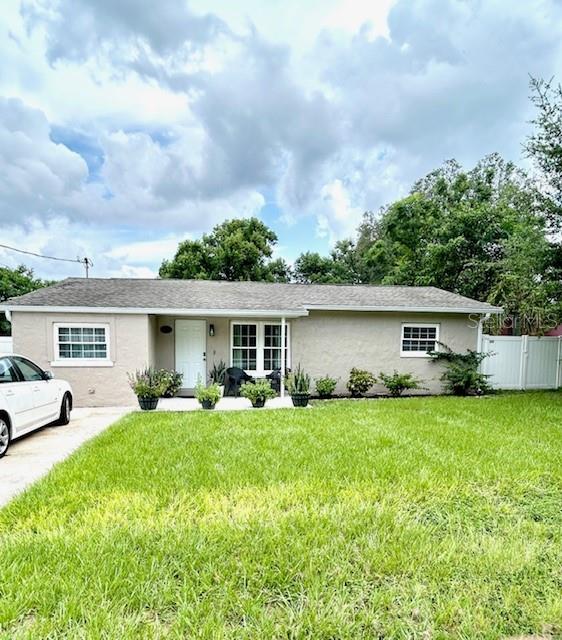 a view of a house with a yard