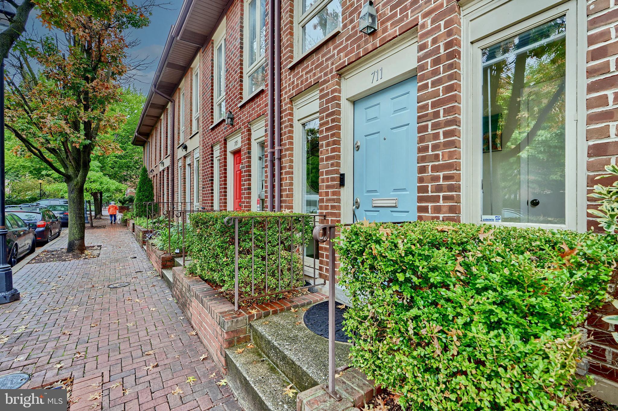 a view of a pathway both side of the house