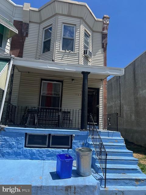 a view of a house with wooden deck