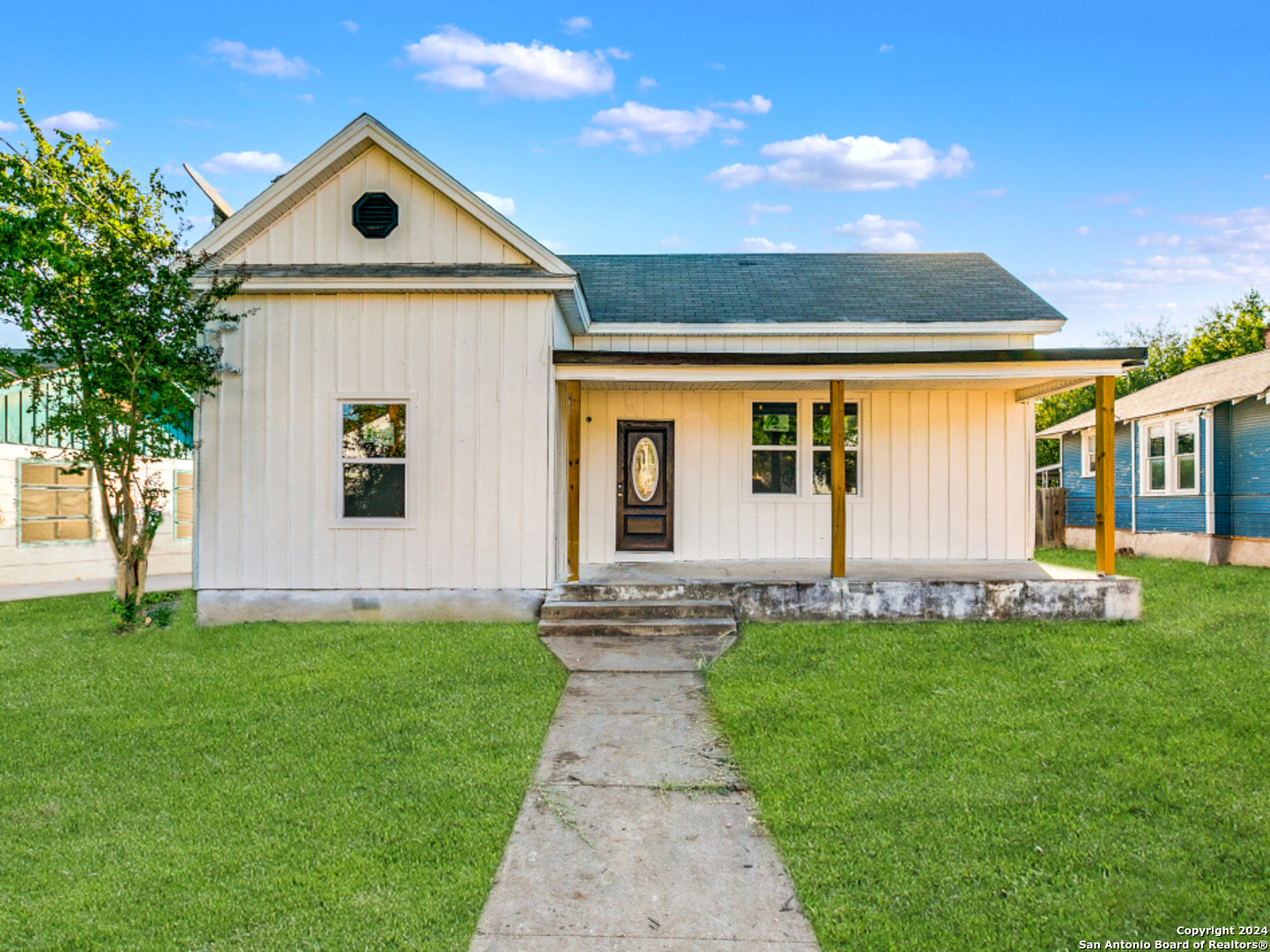 a front view of a house with a yard