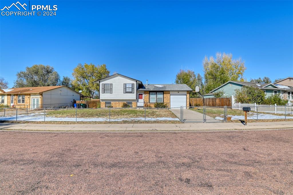 View of front of property with a garage