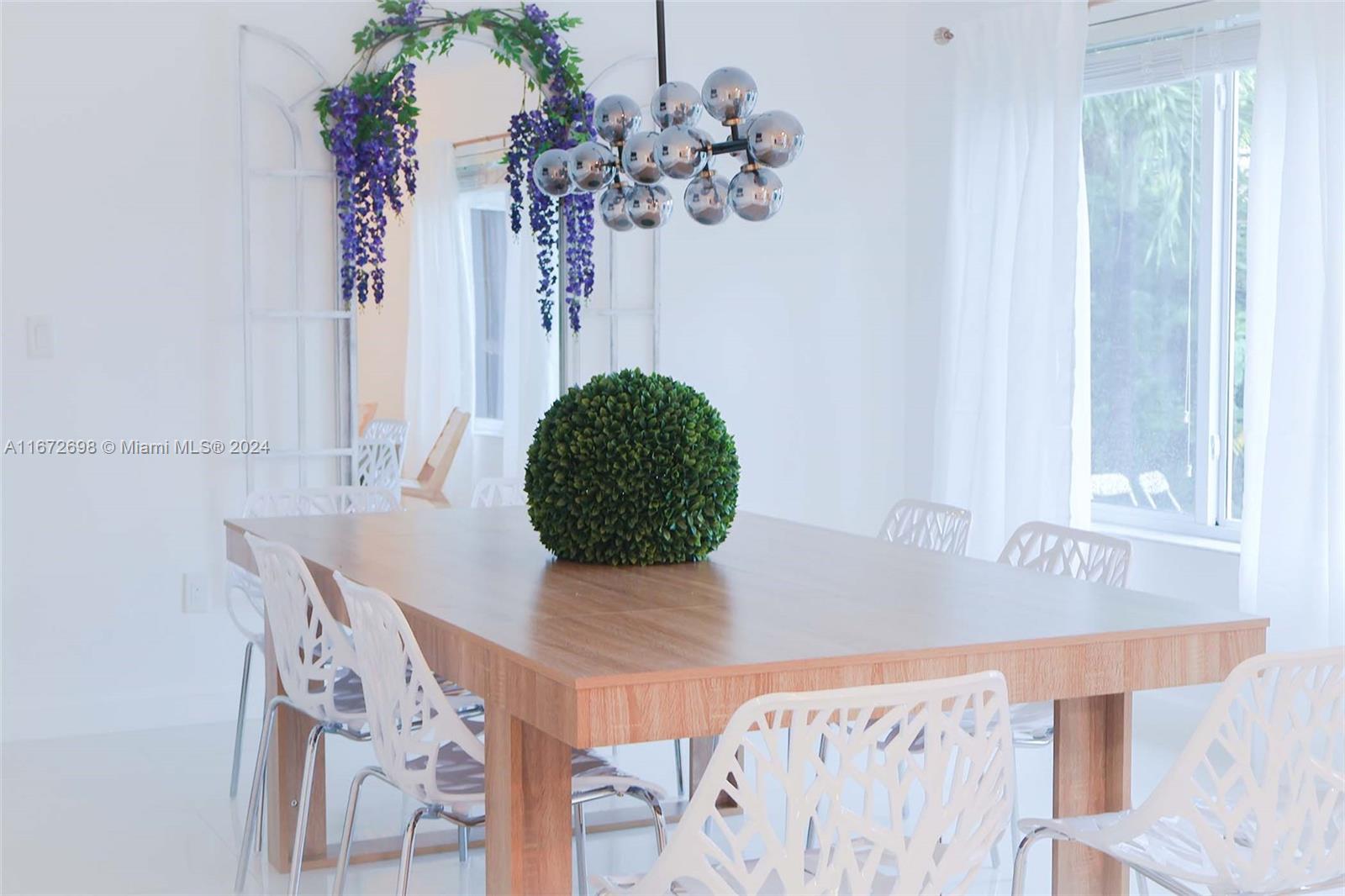 a vase of flowers sitting on a table