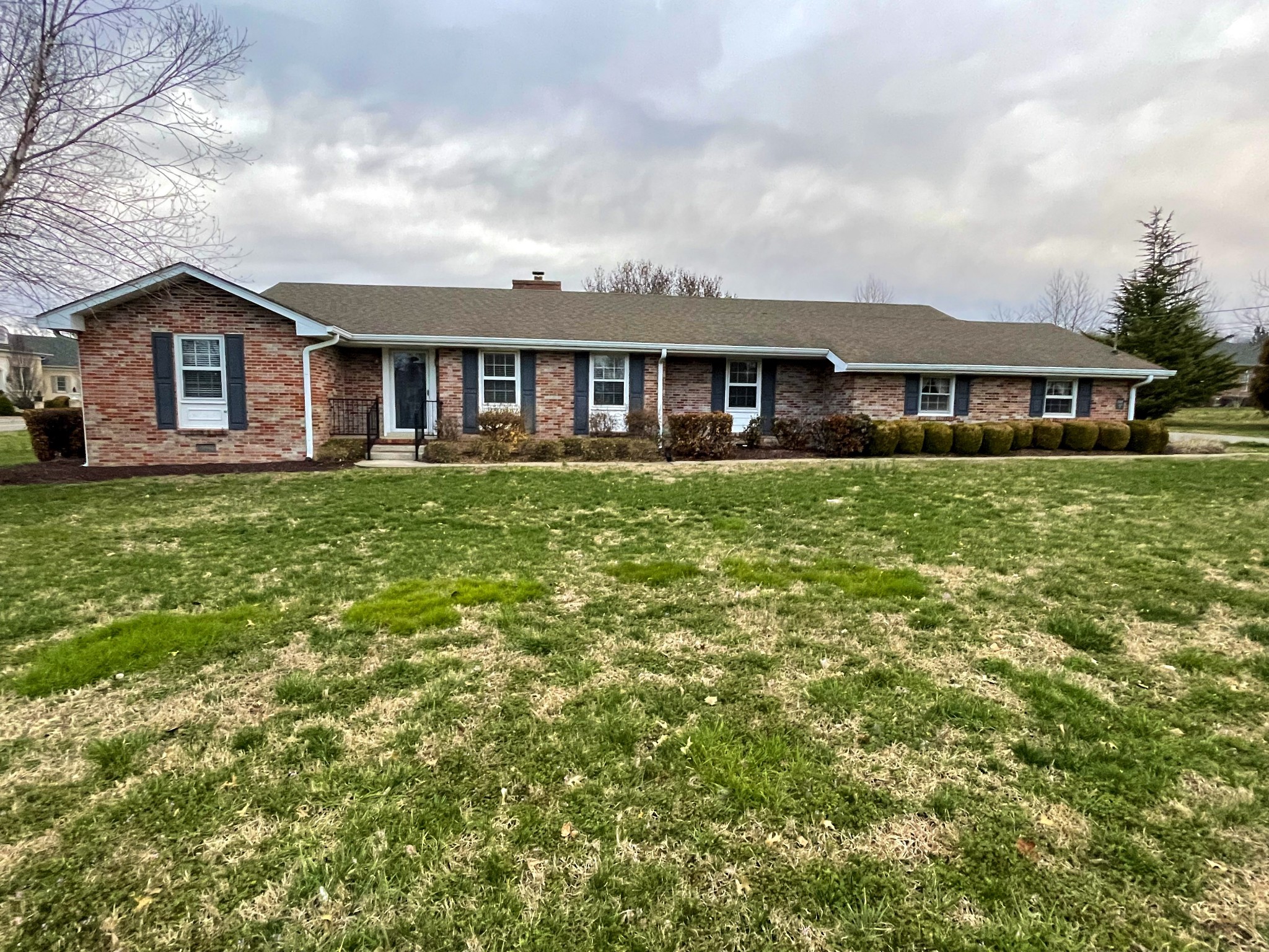 a front view of a house with yard