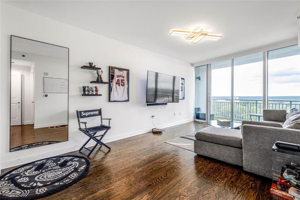 a living room with furniture and a flat screen tv