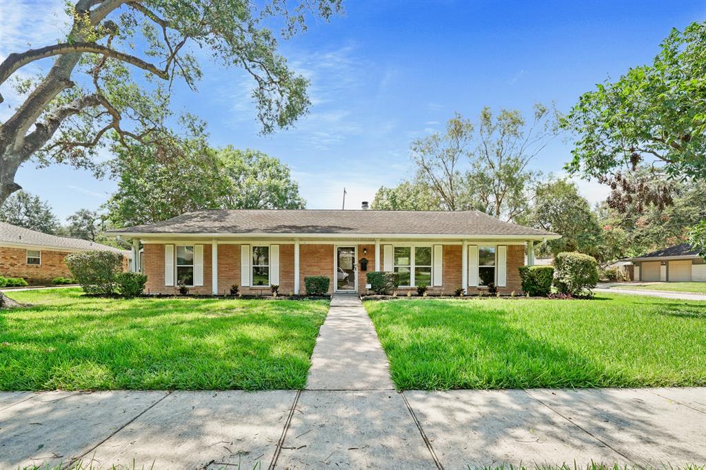 front view of a house and a yard